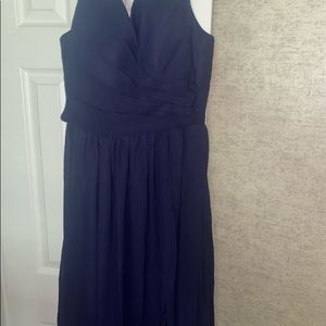 Navy blue dress with slit and lace up back.